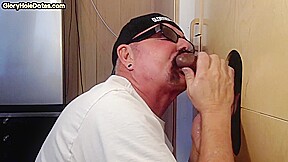 Gloryhole homemade DILF sucks black dong in closeup BJ